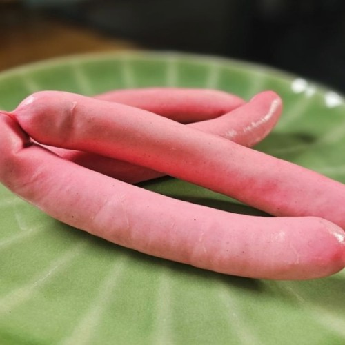 Pourquoi dit-on "knack" pour désigner la saucisse de Strasbourg ?
